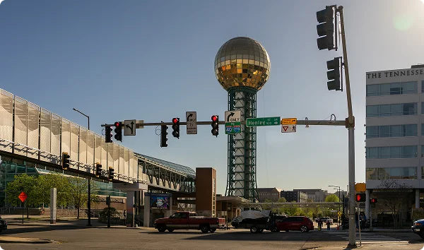 Knoxville, Tennessee - 4-1-23:Traffic intersection near Sunsphere and world's fair park. Henley street Knoxville. Tennessean Hotel in the background.